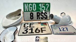 Vintage License Plates Including South Sudan and NGO License Plates. and Porcelain Enamel Bed Pans. 