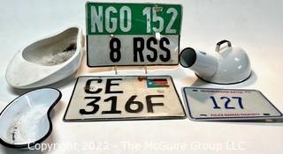 Vintage License Plates Including South Sudan and NGO License Plates. and Porcelain Enamel Bed Pans. 