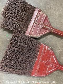 Two (2) Vintage Fuller Brush Company Red Metal Brooms