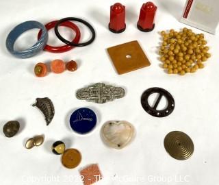 Group of Bakelite Items Including Salt & Pepper Shakers, Buttons, Beads and Edwardian Duette Claw Set Rhinestone Brooch that can be worn as Dress or Shoe Clips.  Missing Stone