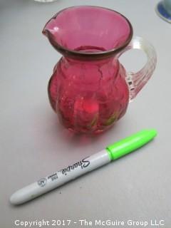 Collection including Pilgrim Cranberry Glass pitcher, tall crystal vase and Vignelli Heller loaf pan 