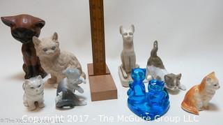 Collection of cat figurines in various media