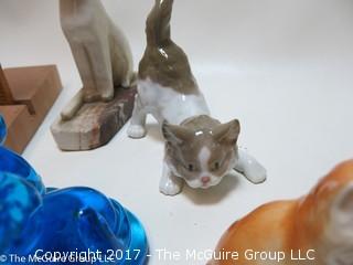 Collection of cat figurines in various media