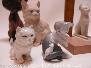 Collection of cat figurines in various media