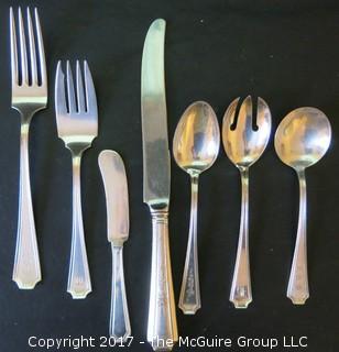 Durgin (later Gorham) Sterling cutlery and chest: 18 dinner forks; 18 knives; 18 meat forks; 18 grapefruit spoons; 18 soup spoons; 22 tea spoons, 2 large serving spoons; 6 medium size serving spoons, 11 small serving spoons, 1 ladle, 17 butter knives and 7 accessory pieces; hallmark shown in photos.  Total weight sterling (excludes dinner knives): 3126 grams  