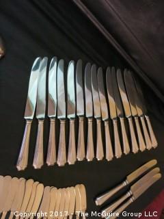 Durgin (later Gorham) Sterling cutlery and chest: 18 dinner forks; 18 knives; 18 meat forks; 18 grapefruit spoons; 18 soup spoons; 22 tea spoons, 2 large serving spoons; 6 medium size serving spoons, 11 small serving spoons, 1 ladle, 17 butter knives and 7 accessory pieces; hallmark shown in photos.  Total weight sterling (excludes dinner knives): 3126 grams  