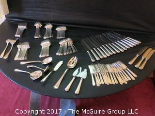 Durgin (later Gorham) Sterling cutlery and chest: 18 dinner forks; 18 knives; 18 meat forks; 18 grapefruit spoons; 18 soup spoons; 22 tea spoons, 2 large serving spoons; 6 medium size serving spoons, 11 small serving spoons, 1 ladle, 17 butter knives and 7 accessory pieces; hallmark shown in photos.  Total weight sterling (excludes dinner knives): 3126 grams  