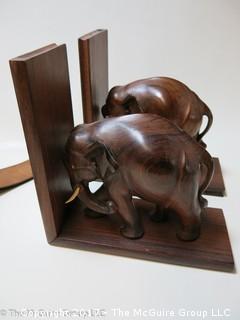 Collection including wood carved elephant bookends (missing 1 tusk), Barber's leather razor strap and vintage clip on sun glasses 