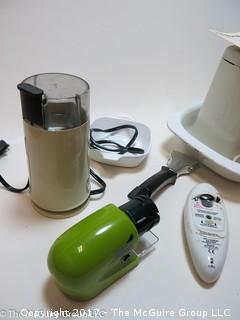 Assorted kitchen appliances including food processor, waffle iron, coffee grinder, can opener and knife sharpeners 