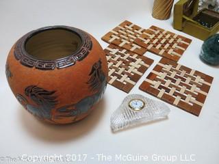 Collection including Irish Kerry Glass, stacked ceramic pigs, and wooden trivets