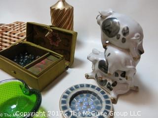 Collection including Irish Kerry Glass, stacked ceramic pigs, and wooden trivets