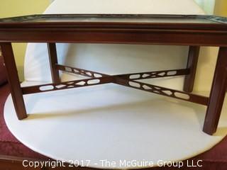 Mahogany coffee table with cross stretchers below; 19 x 35 x 16" tall