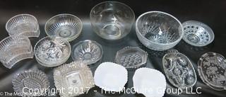 Collection of mostly clear glass serving ware 