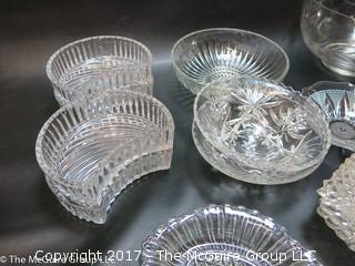 Collection of mostly clear glass serving ware 