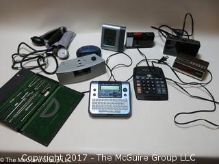 Collection including German drafting set, several clock radios, calculator and stethoscope