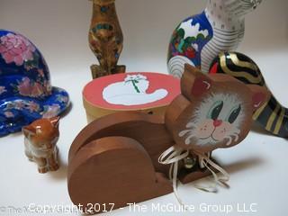 Assortment of feline figurines in various media