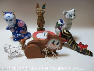 Assortment of feline figurines in various media