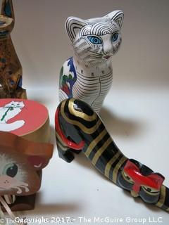 Assortment of feline figurines in various media