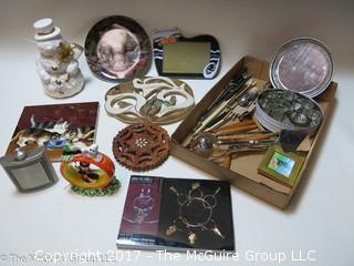 Eclectic collection including trivets and pewter flask