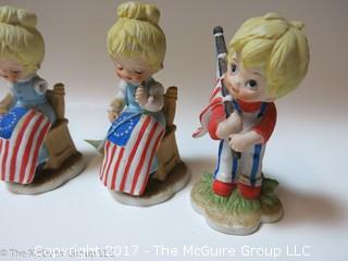 Collection of figurines including those with EU/U.S. flag