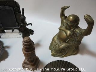 Collection including scalloped shell brass bookends, brass Buddha, and feline themed collectibles 