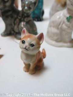 Collection of feline figurines in various media