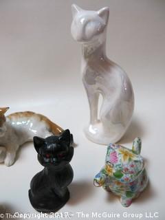 Collection of feline figurines in various media