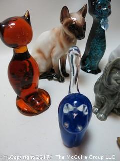 Collection of feline figurines in various media