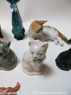 Collection of feline figurines in various media