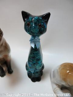 Collection of feline figurines in various media