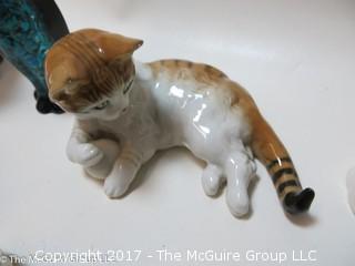 Collection of feline figurines in various media