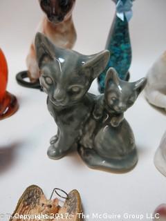 Collection of feline figurines in various media