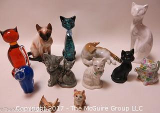 Collection of feline figurines in various media