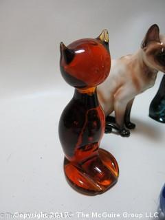 Collection of feline figurines in various media