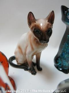 Collection of feline figurines in various media