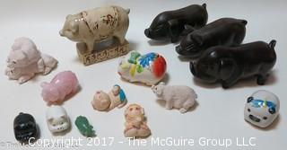 Collection of figurines including mostly pigs 