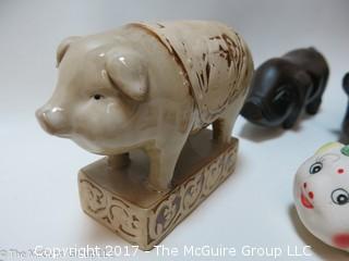 Collection of figurines including mostly pigs 