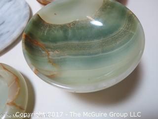 Assorted stone plates, bowls, and eggs 