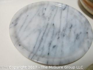 Assorted stone plates, bowls, and eggs 