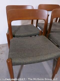 Danish M-C Modern teak dining table and matching chairs (5 side; 1 arm) ; table expands; with leaves stored on the underside, as shown; 45"D x 28 1/2" T