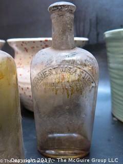 Collection of ceramic pottery including McCoy and vintage glass bottles 