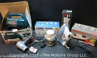 Collection of household appliances including 2 flatirons, hair dryer, knife sharpener, Hoover, Cuisinart chopper and cream whipper 