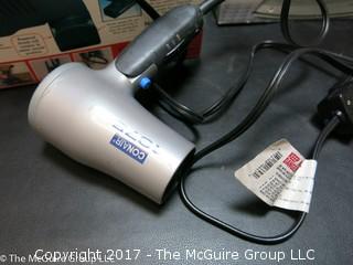 Collection of household appliances including 2 flatirons, hair dryer, knife sharpener, Hoover, Cuisinart chopper and cream whipper 