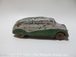 Eclectic collection including pottery, music box, electric flatiron and vintage miniature toy car 