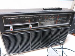 Collection including Emerson boombox, TMK TV, GE transistor radio and Realistic short wave radio 