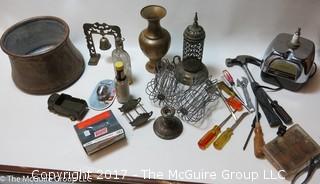 Collection including copper kettle, juicit base, tools, gutter accessories, sterling candle-stand, model army truck and clear glass bottle 