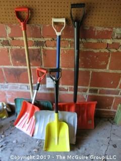 Collection of lawn and garden tools, snow shovels, planters and watering cans 