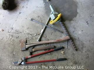 Collection of lawn and garden tools, snow shovels, planters and watering cans 