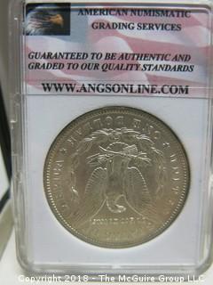 1900 MORGAN SILVER DOLLAR; SLABBED AND GRADED MS 68 BY ANGS