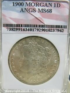 1900 MORGAN SILVER DOLLAR; SLABBED AND GRADED MS 68 BY ANGS